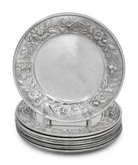A Set of Eight S. Kirk and Son Repousse Silver Bread Plates