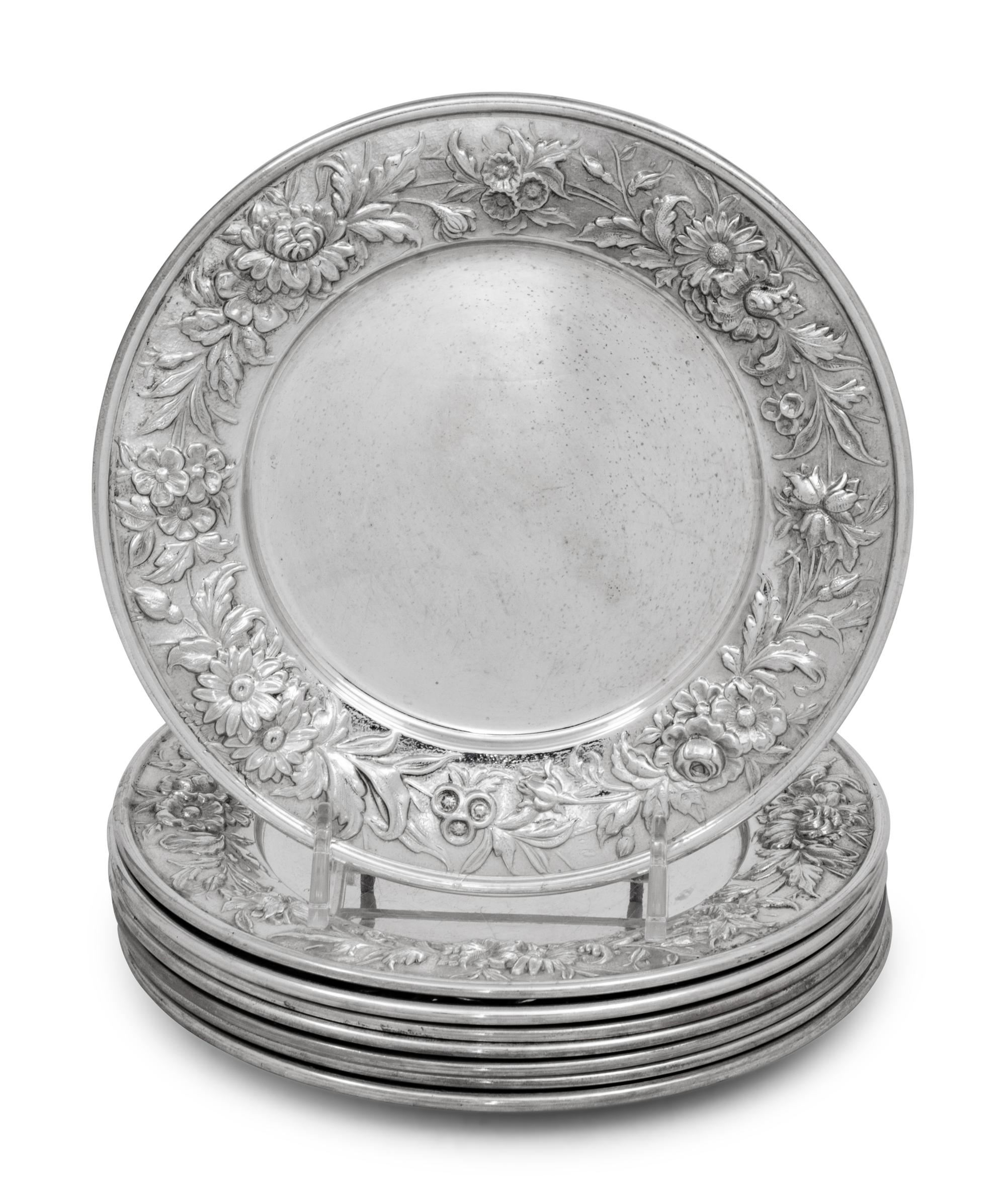 A Set of Eight S. Kirk and Son Repousse Silver Bread Plates