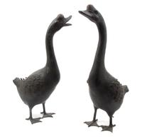 A Pair of Japanese Painted Lead Geese, Height of taller 24 3/8 inches.