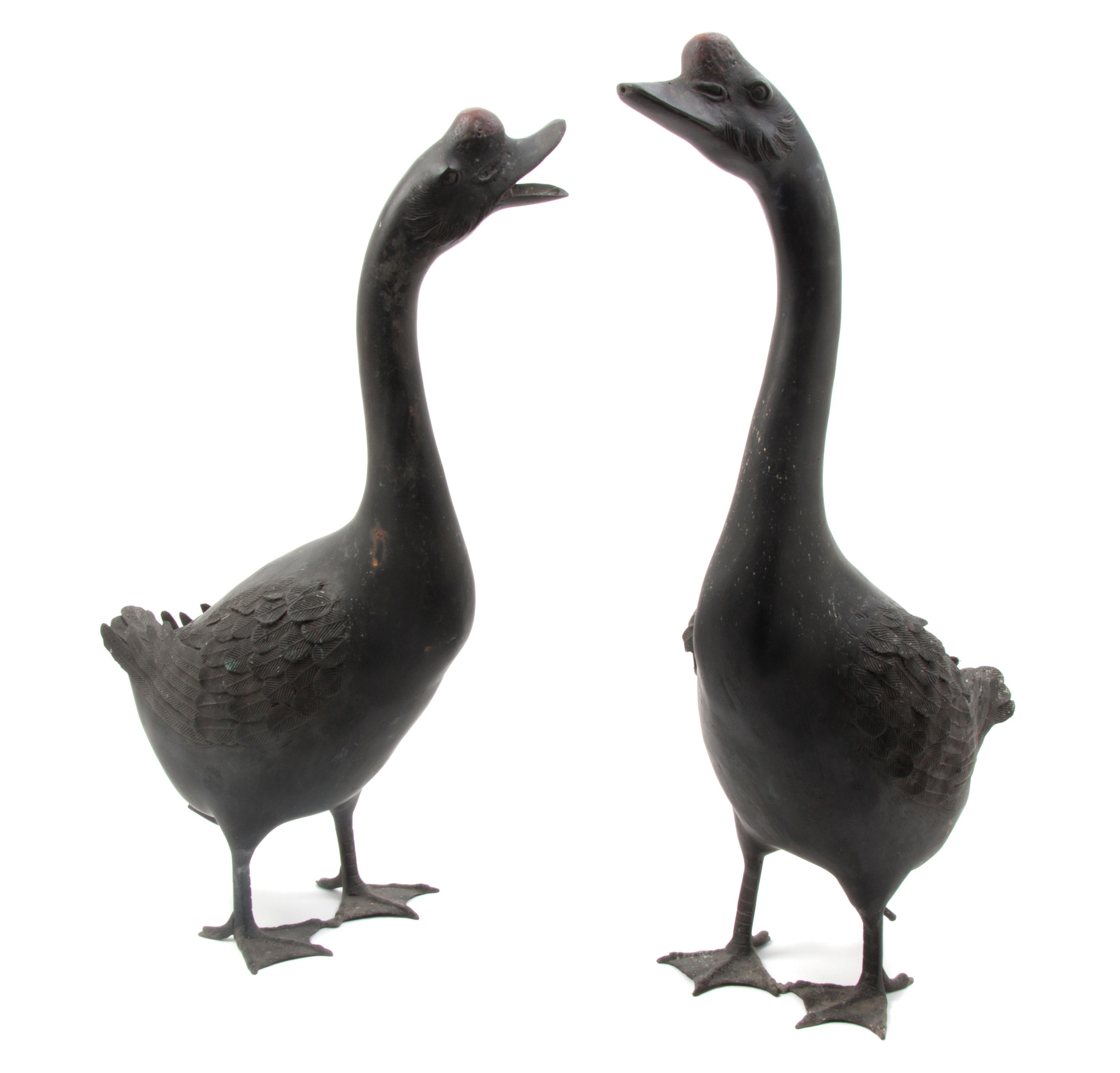 A Pair of Japanese Painted Lead Geese, Height of taller 24 3/8 inches.