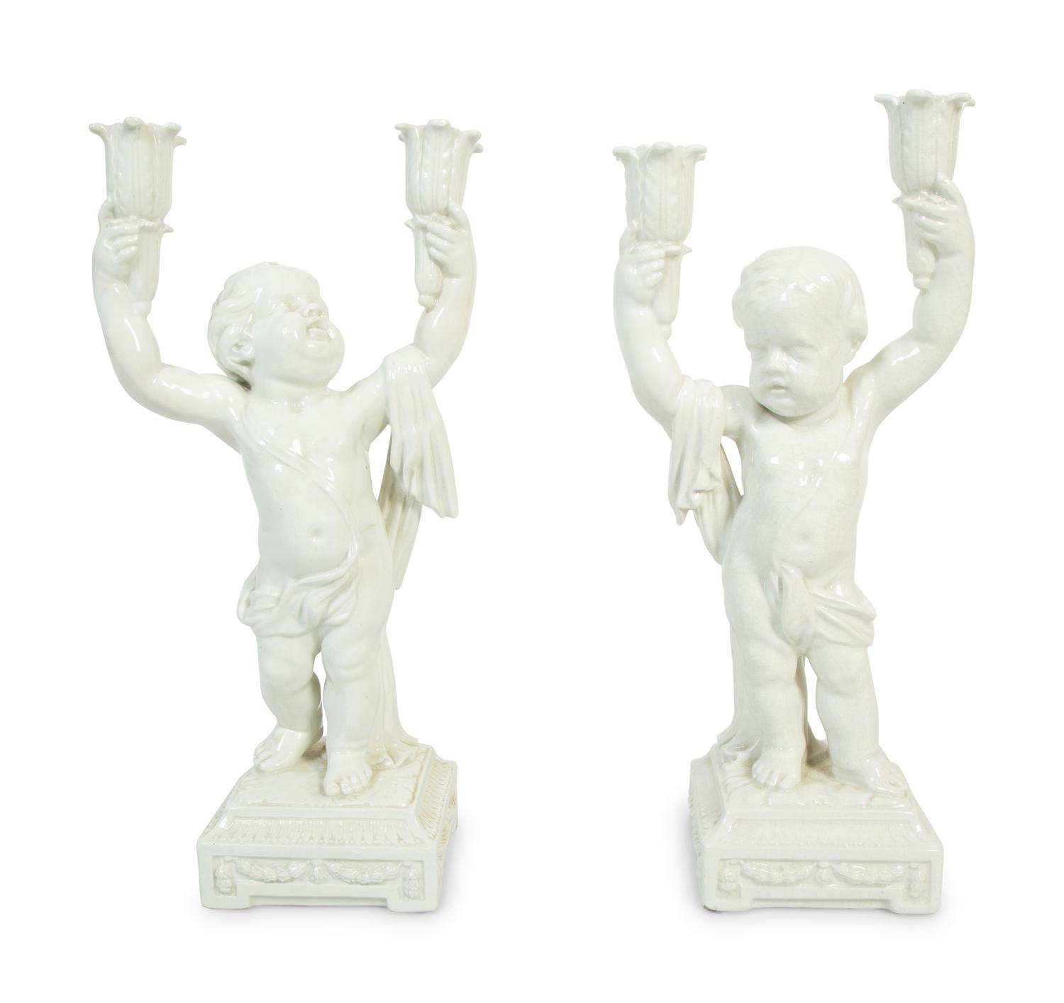 A Pair of Italian Creamware Figural Candelabra