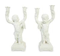 A Pair of Italian Creamware Figural Candelabra