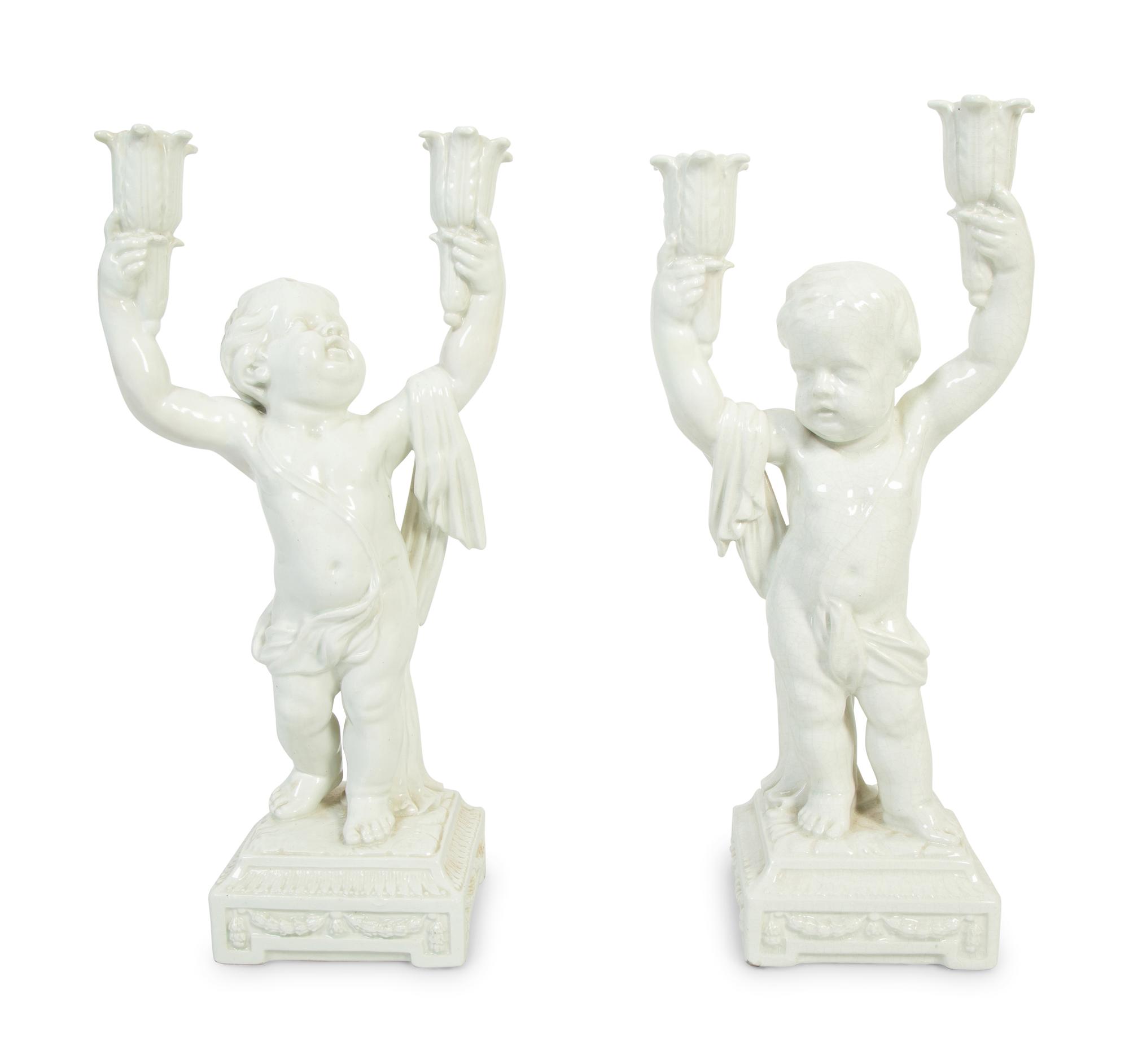 A Pair of Italian Creamware Figural Candelabra