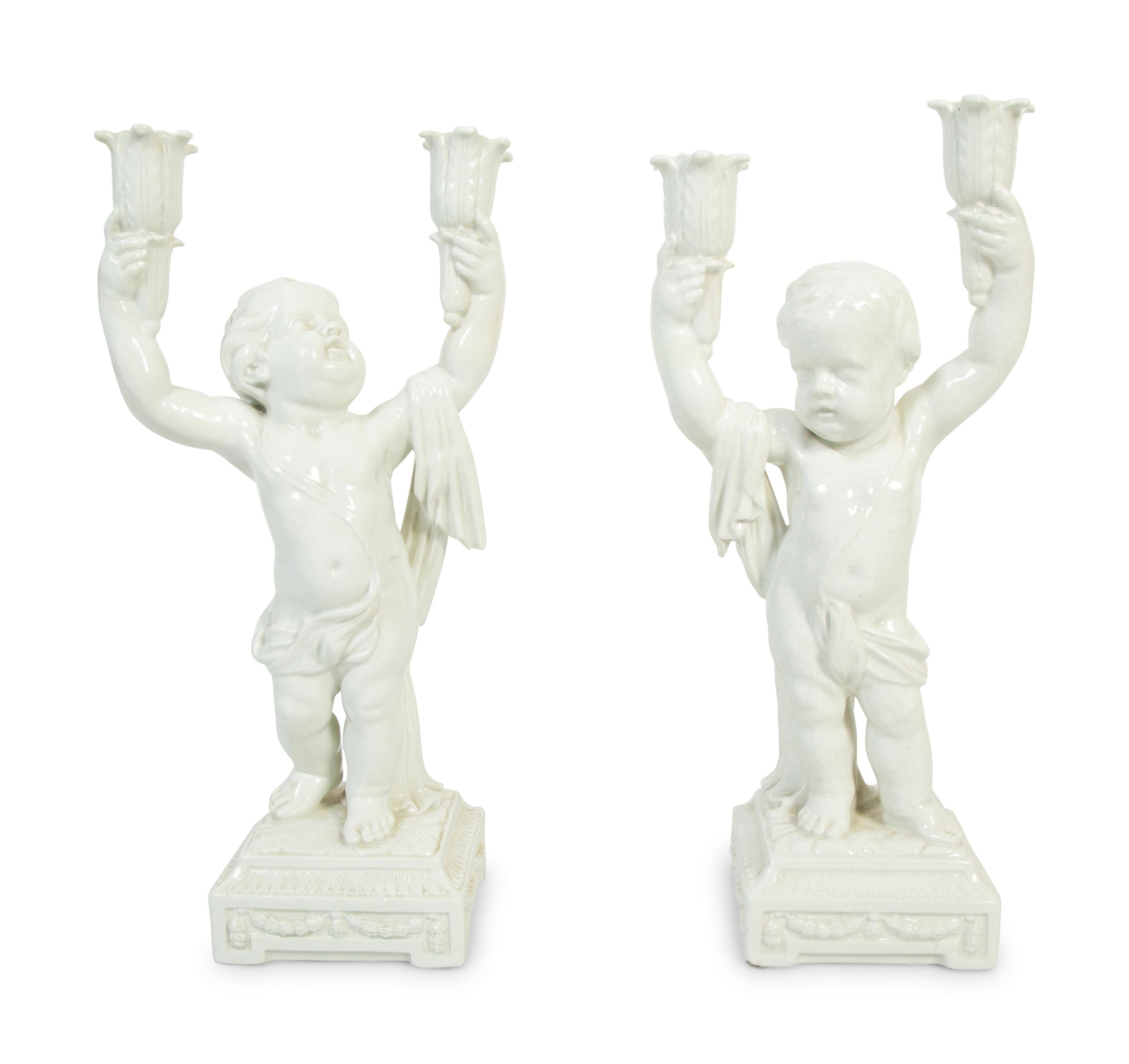A Pair of Italian Creamware Figural Candelabra