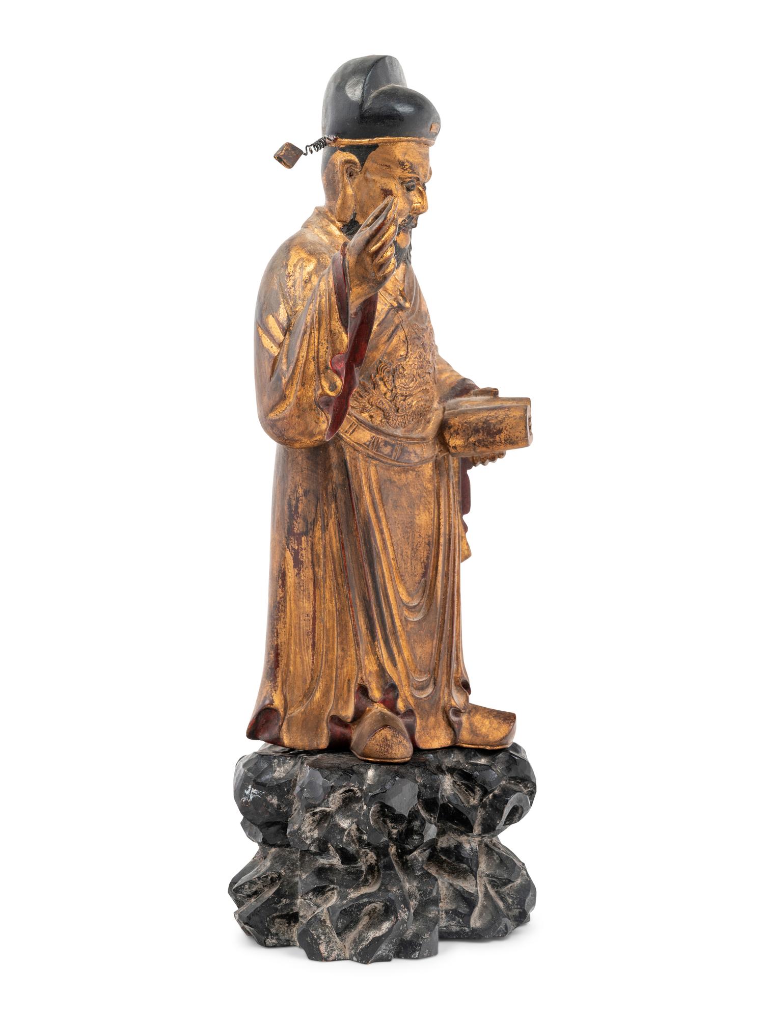 A Chinese Gilt Decorated Wood Figure of a Standing Official