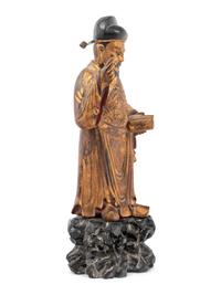 A Chinese Gilt Decorated Wood Figure of a Standing Official