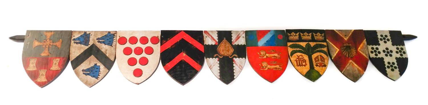 A Painted Wood Wall Ornament Width 57 inches.