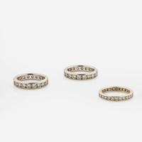 A Collection of Three 18K Gold and Diamond Bands