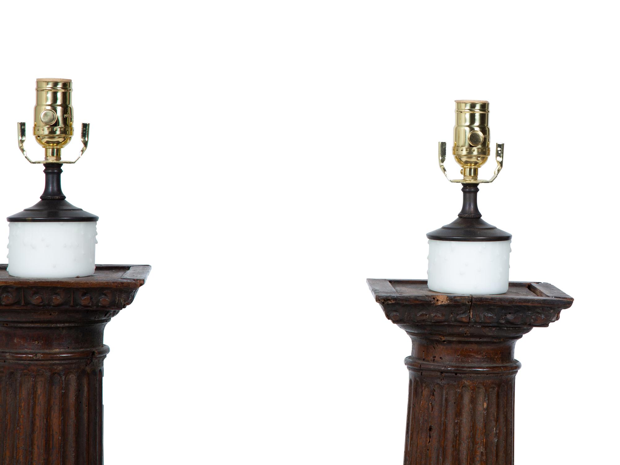 A Pair of Italian Carved Walnut Columns Mounted as Lamps — 18TH CENTURY