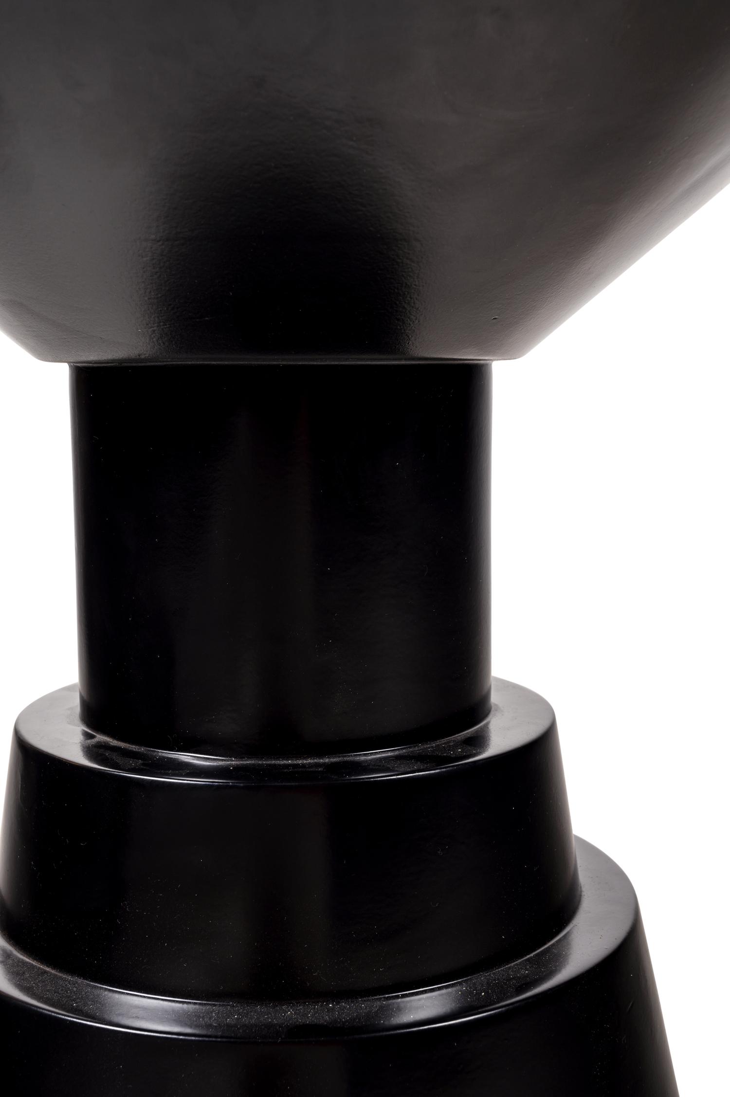 A Pair of Black Painted Pedestals
