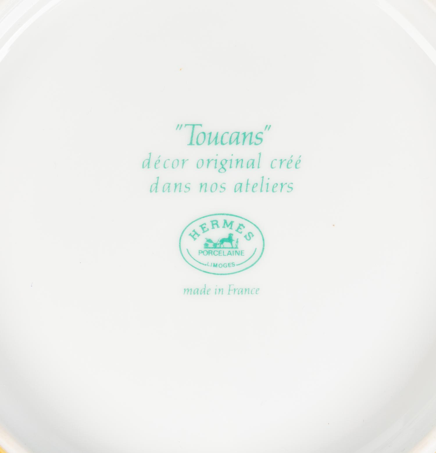 An Hermès Toucans Porcelain Dinner Service