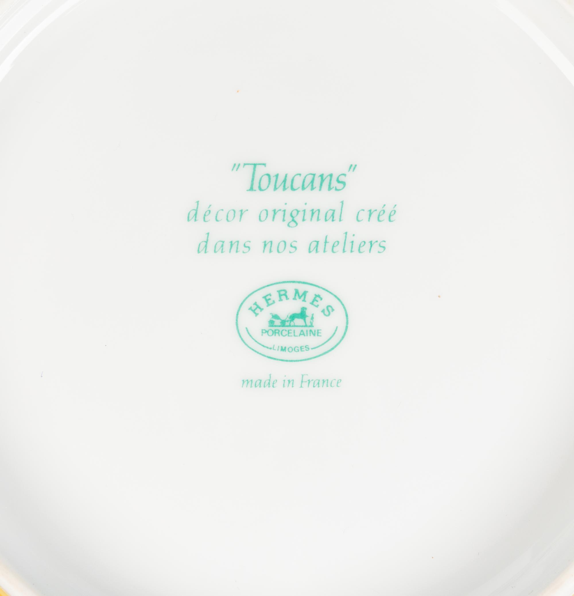 An Hermès Toucans Porcelain Dinner Service