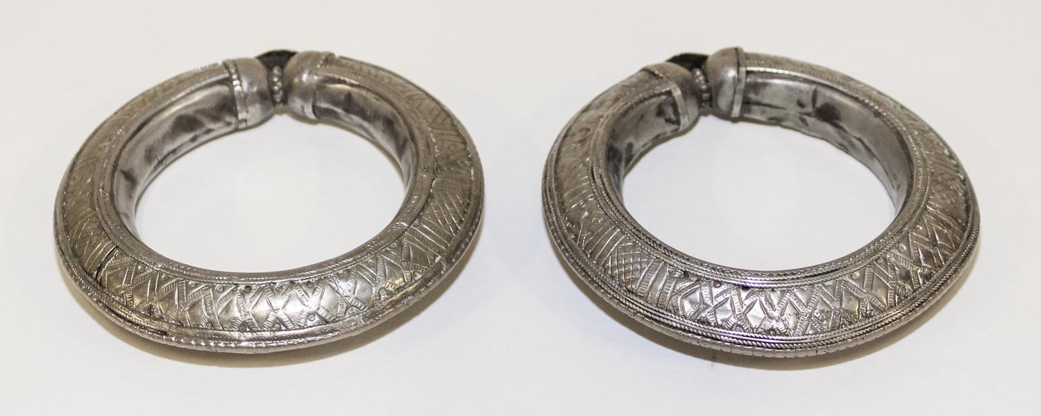 A Pair of Yemeni Silver Bangles Diameter of exterior 4 1/4 inches.