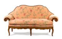 An Italian Carved Walnut Settee, Width 73 inches.