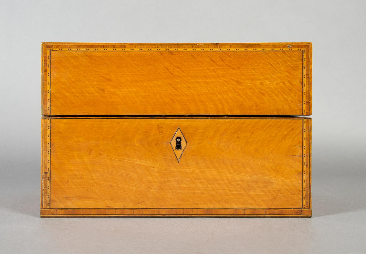An English Satinwood and Walnut Tea Caddy, Height 6 1/8 x width 9 1/4 x depth 5 3/8 inches.