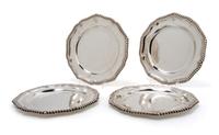 A Set of Four English Silver Plates, London, Diameter 9 3/4 inches.
