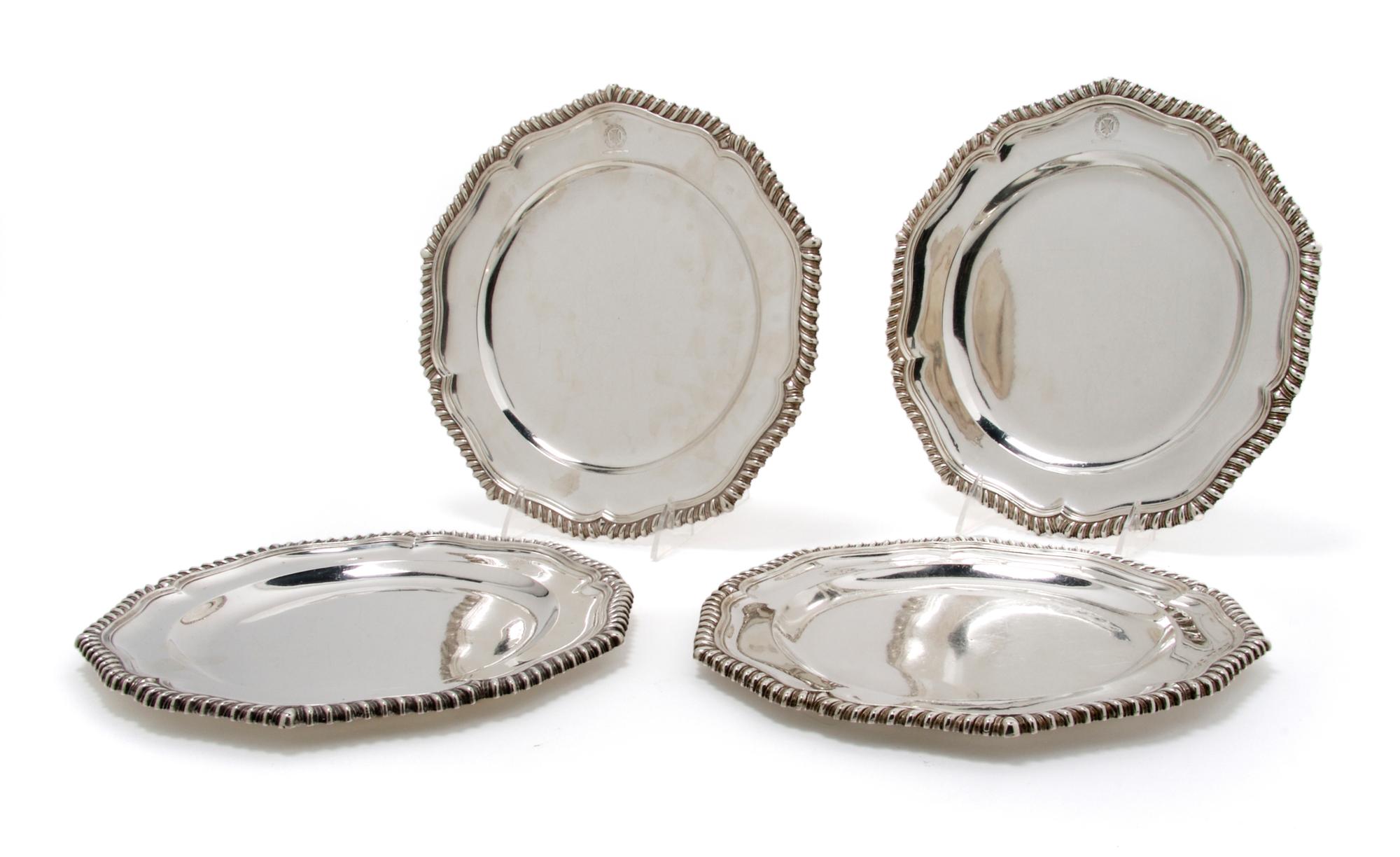 A Set of Four English Silver Plates, London, Diameter 9 3/4 inches.