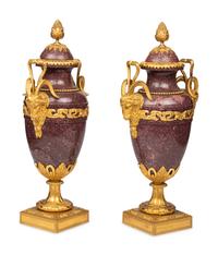 A Pair of Louis XVI Style Gilt Bronze Mounted Porphyry Urns