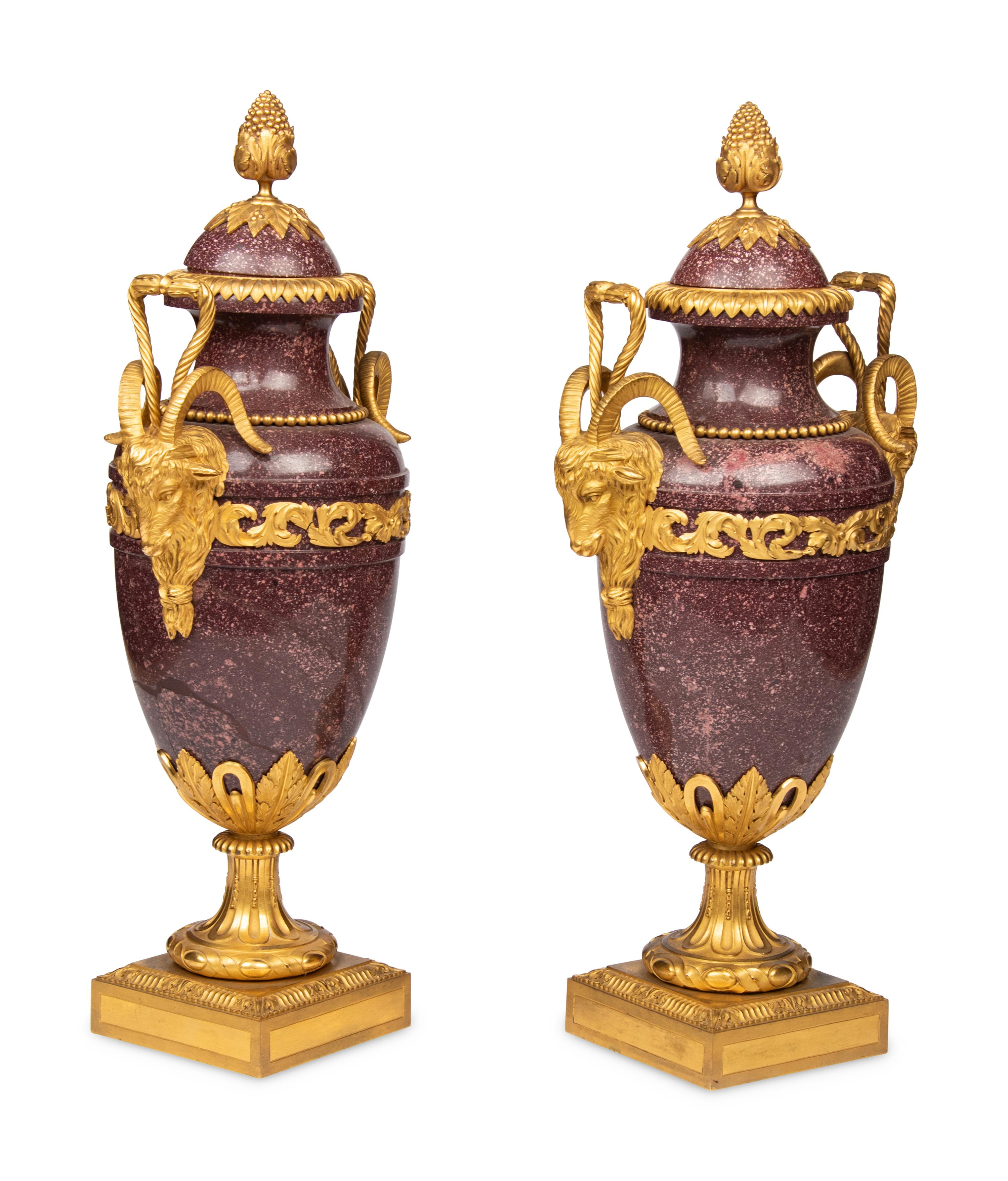 A Pair of Louis XVI Style Gilt Bronze Mounted Porphyry Urns