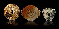 A Group of Seven Carved Jade Bi Discs Diameter of largest 9 inches.