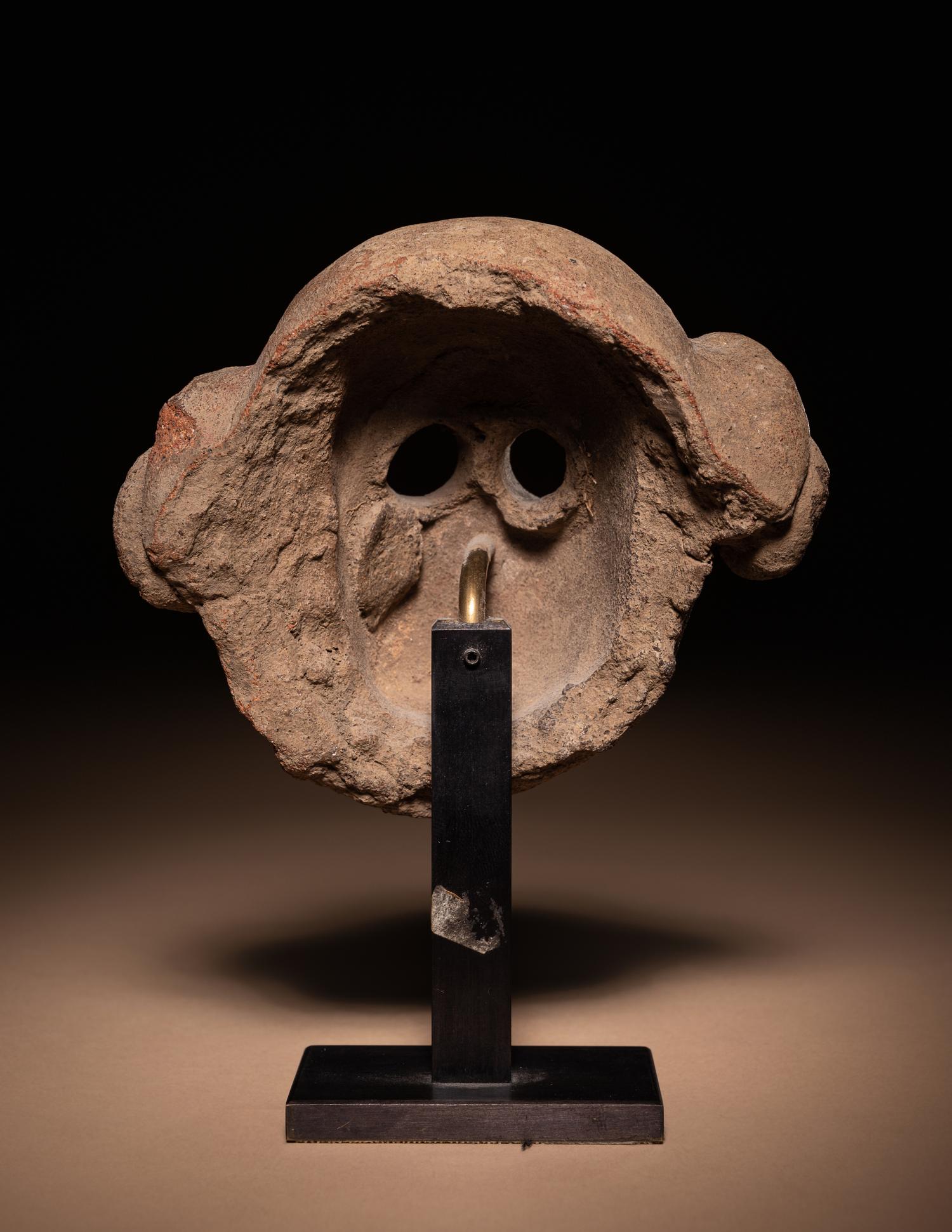 A Maya Terracotta Face Mask