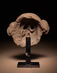 A Maya Terracotta Face Mask