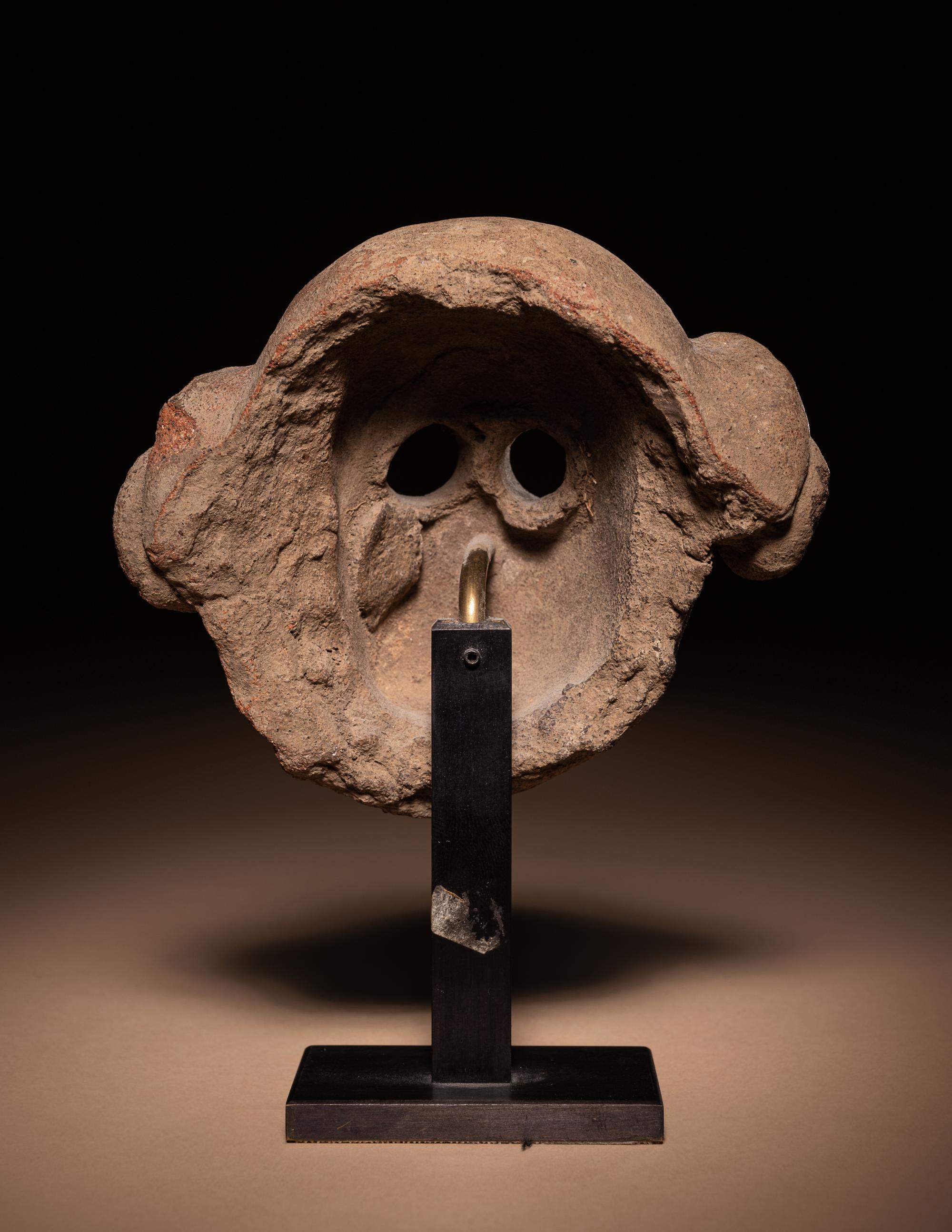 A Maya Terracotta Face Mask