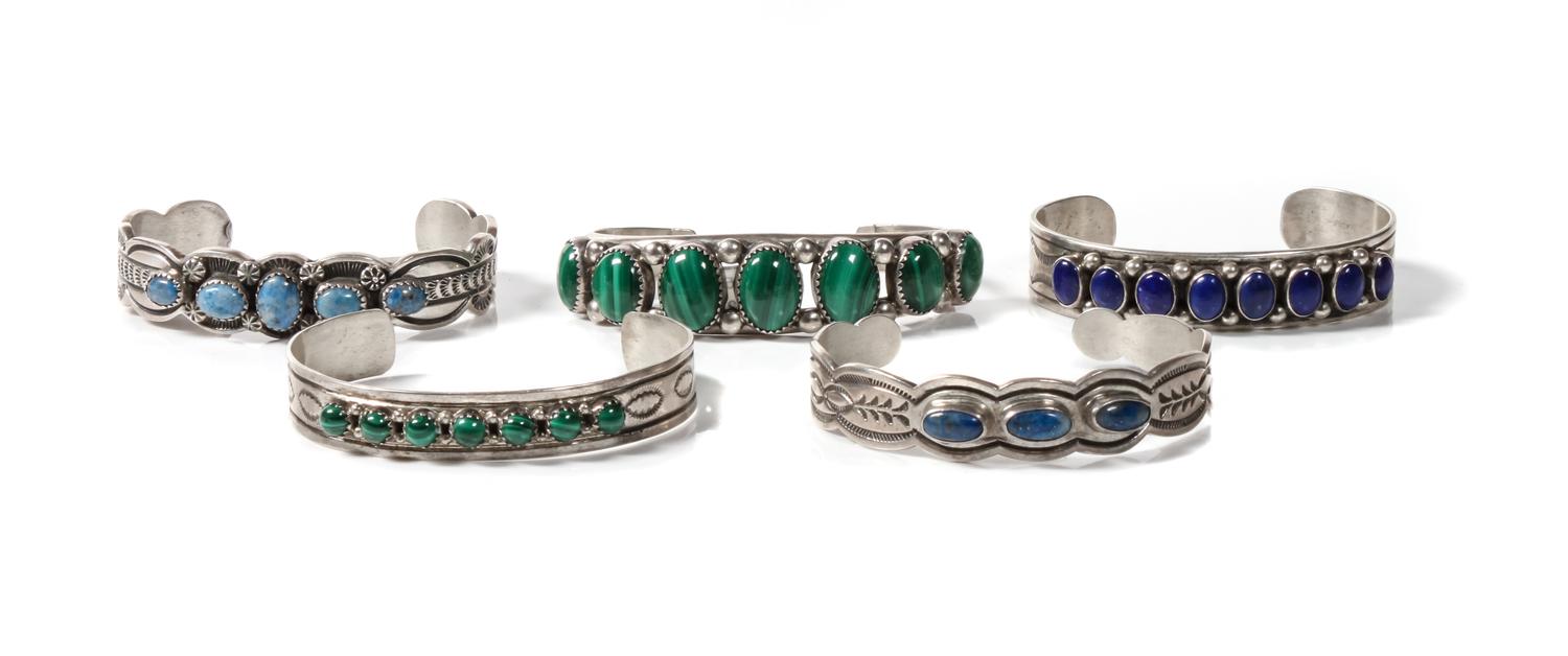 Five Navajo Silver and Varying Stone Bracelets Length of one 5 3/8 x opening 1 x width 5/8 inches