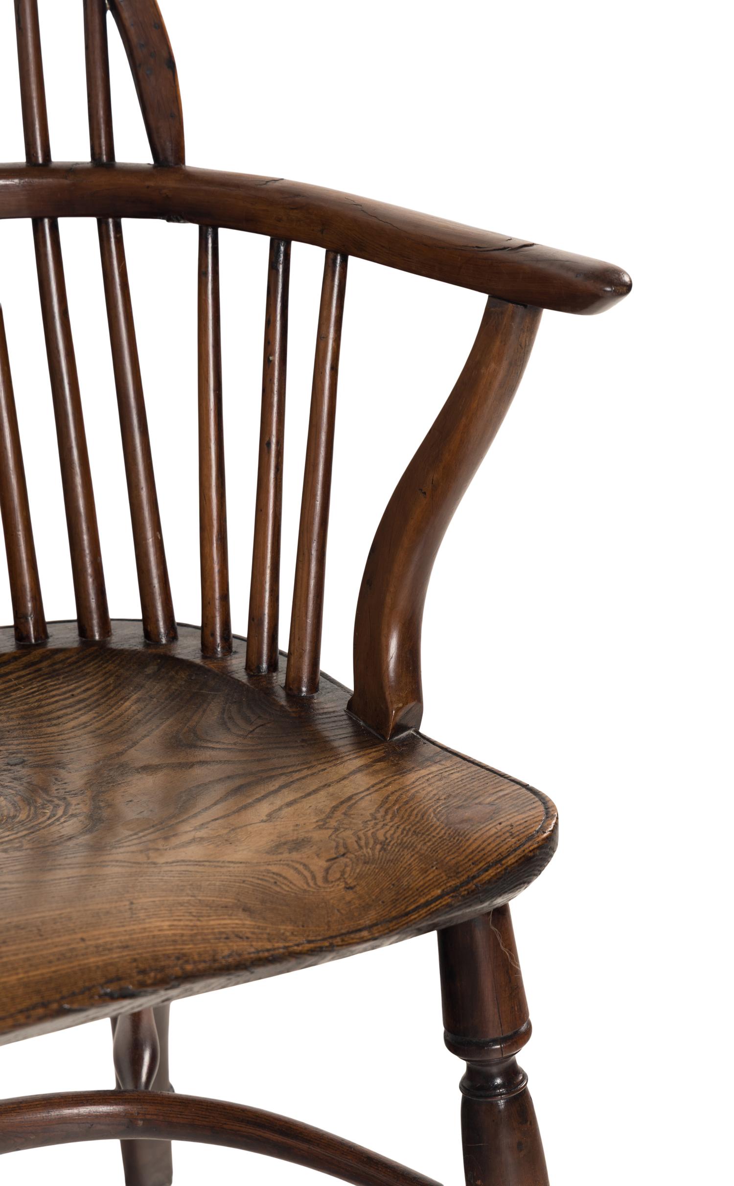 An Assembled Set of Nine Yew, Elm and Beechwood Windsor Armchairs