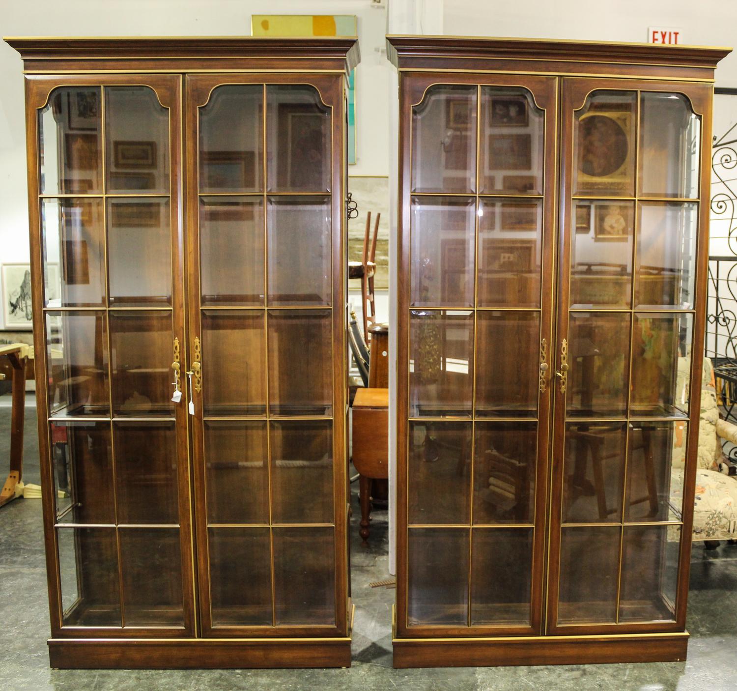 A Pair of Parcel Gilt Vitrine Cabinets Height 85 x width 44 x depth 13 3/4 inches. — 20TH CENTURY