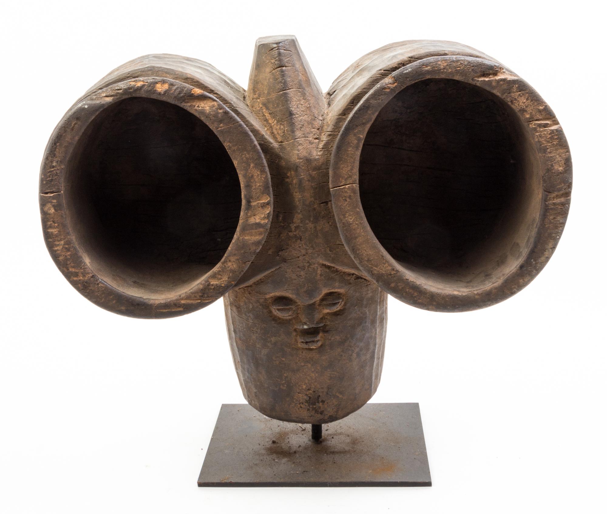Four African Carved Wood Articles Height of tallest 26 1/2 inches.