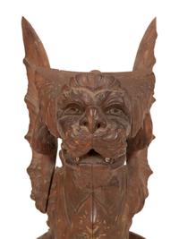 An Italian Carved and Polychromed Seated Dragon