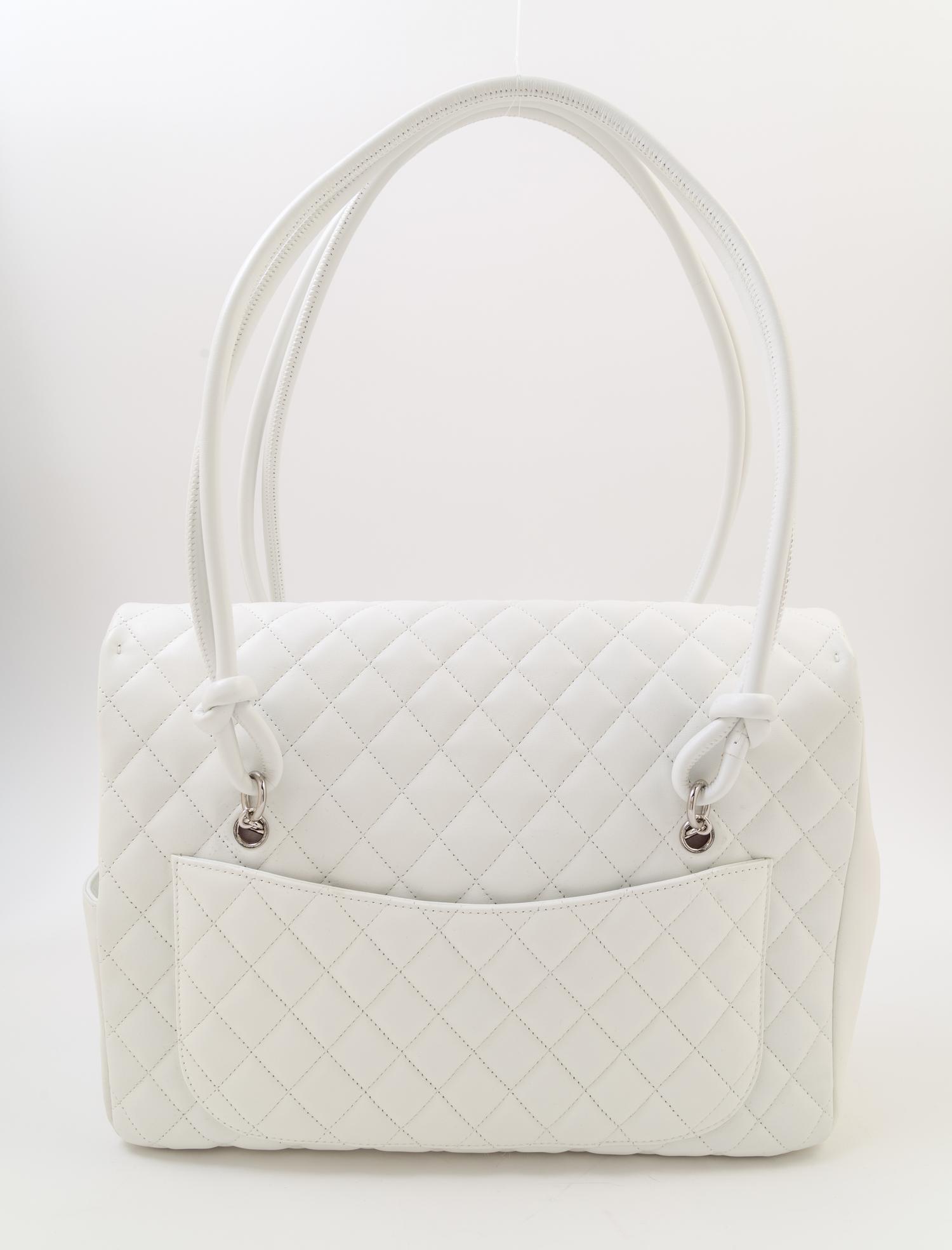 A Chanel White Ligne Cambon Quilted Shoulder Bag, 13/*" x 11" x 4"; Strap drop: 10".