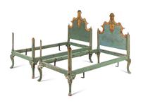 A Pair of Venetian Style Painted and Parcel Gilt Twin Beds