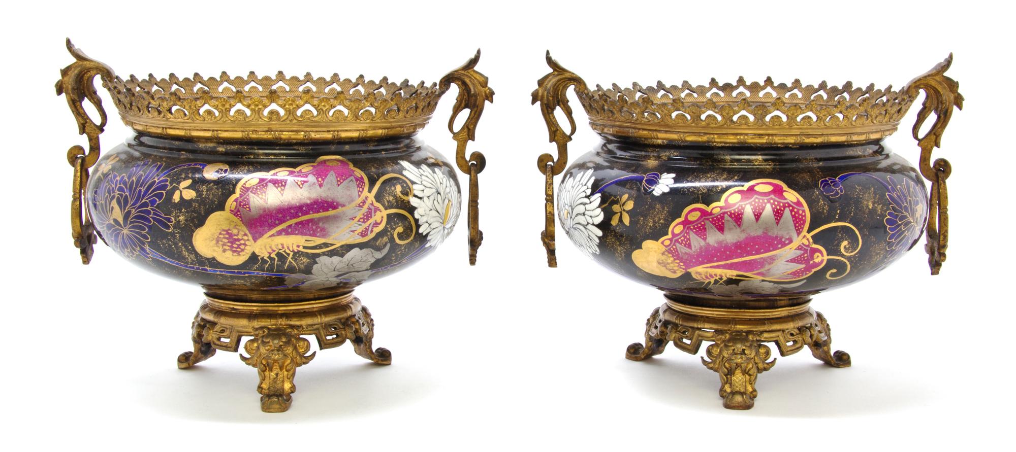 A Pair of Aesthetic Movement Gilt Metal Mounted Porcelain Urns, Height 7 1/4 inches.
