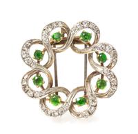 An Edwardian Platinum Topped Gold, Demantoid Garnet and Diamond Pendant/Brooch, Seaman Schepps, 6.40 dwts.