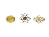 COLLECTION OF YELLOW GOLD BROOCHES