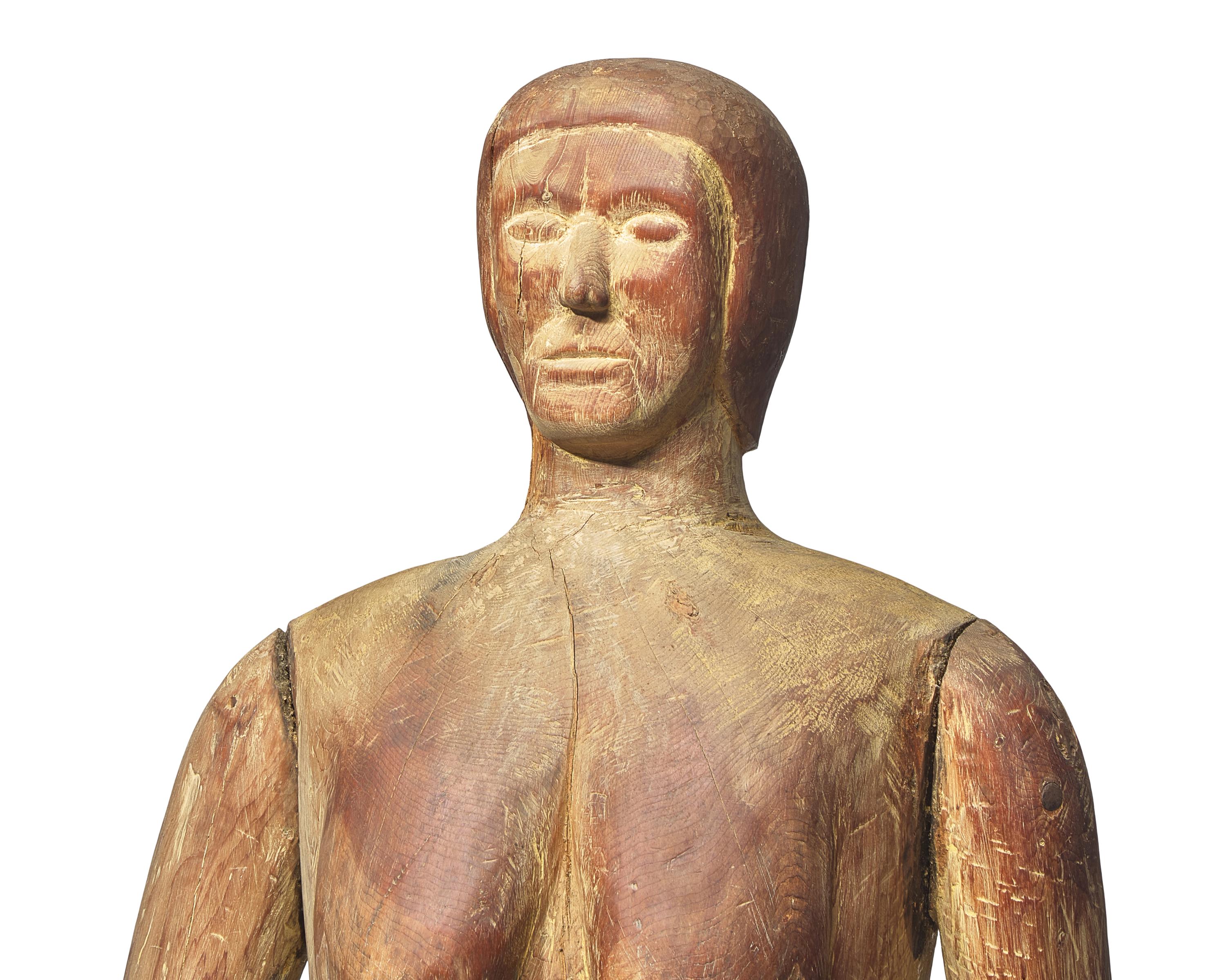 A Life-Size Carved Pine Figure of a Woman