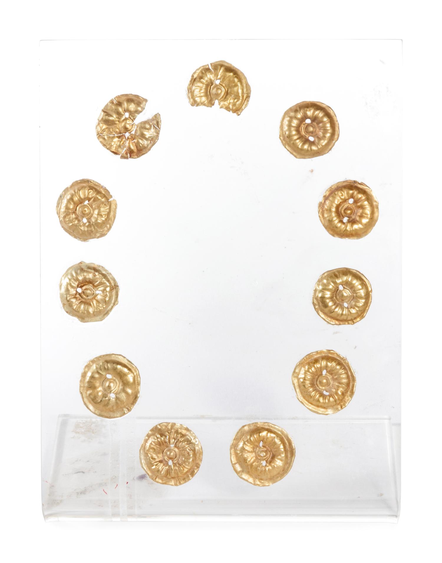Eleven Gilt Metal or Gold Buttons on an Acrylic Stand