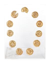 Eleven Gilt Metal or Gold Buttons on an Acrylic Stand