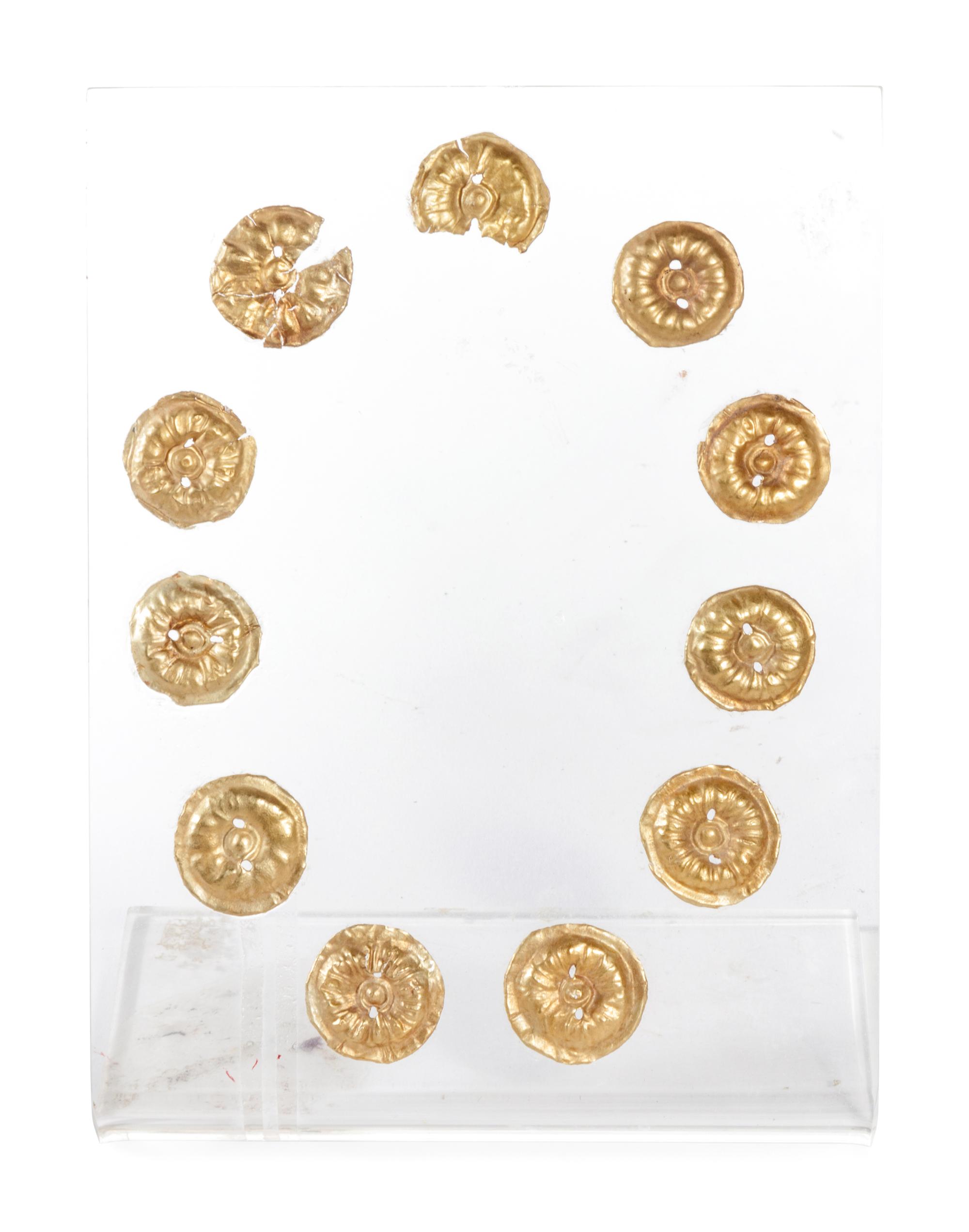 Eleven Gilt Metal or Gold Buttons on an Acrylic Stand