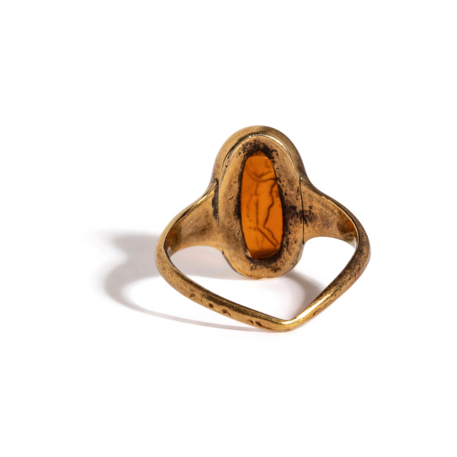 A Roman Carnelian Ring Stone with the God Silenus Playing an Aulos — Set in a gold ring