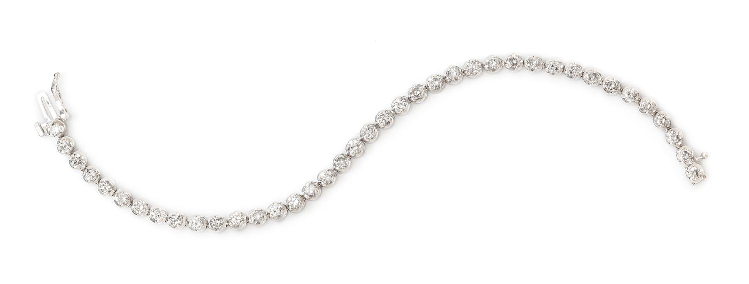 A 14 Karat White Gold and Diamond Line Bracelet, 10.80 dwts.