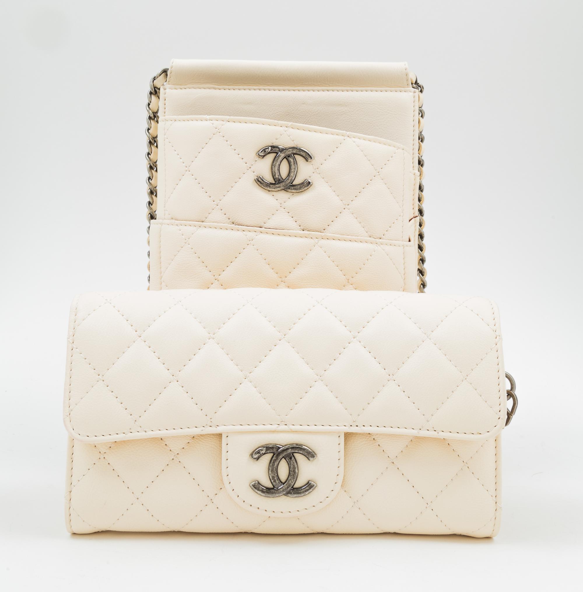 A Chanel Cream Leather Cross Body Pouch with Wallet, Bag: 5.5" x 10" x 1.5"; Wallet: 7.5" x 4.5" x 1.5".