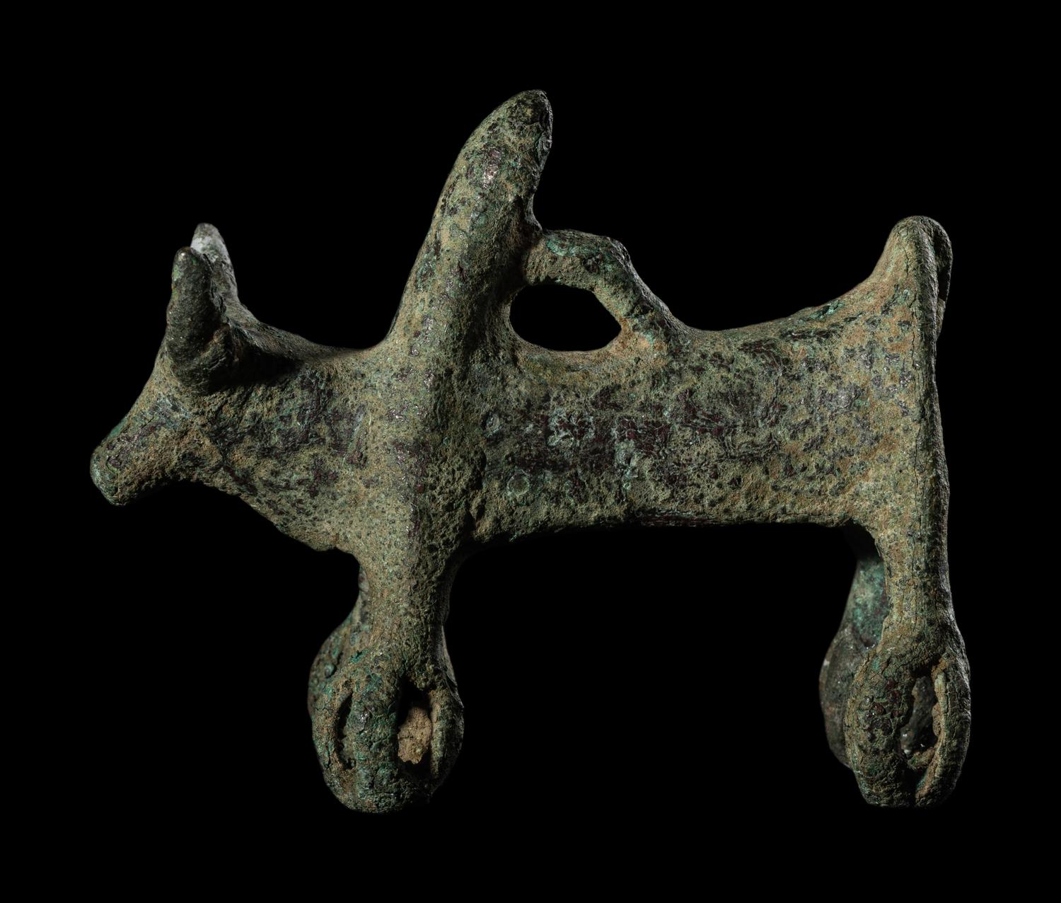 A Luristan Bronze Cow with Four Sphere Feet
