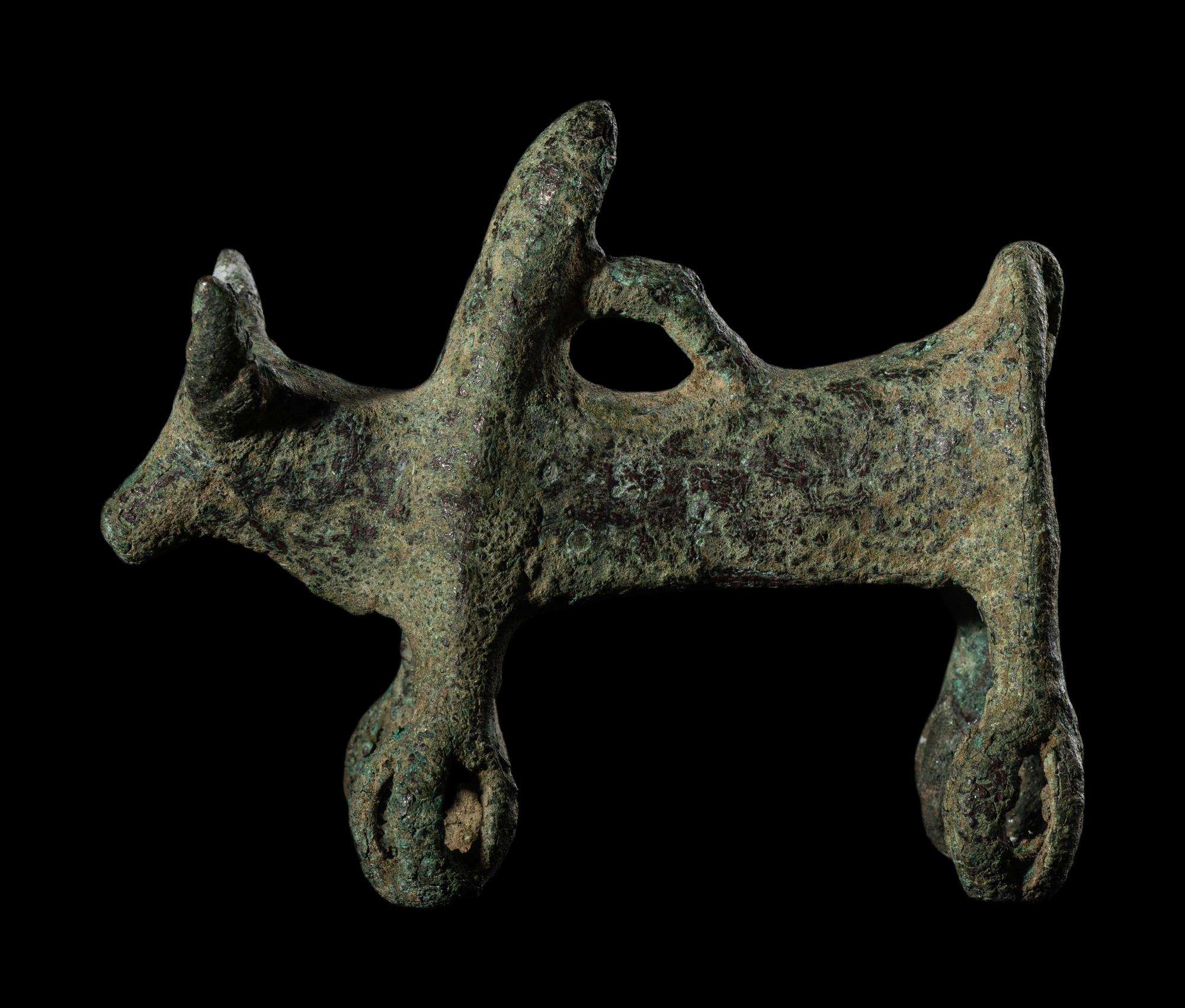 A Luristan Bronze Cow with Four Sphere Feet