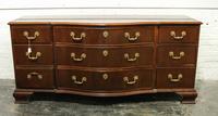 A George III Style Mahogany Chest of Drawers Height 32 x width 69 1/4 x depth 21 1/2 inches. — BAKER, 20TH CENTURY