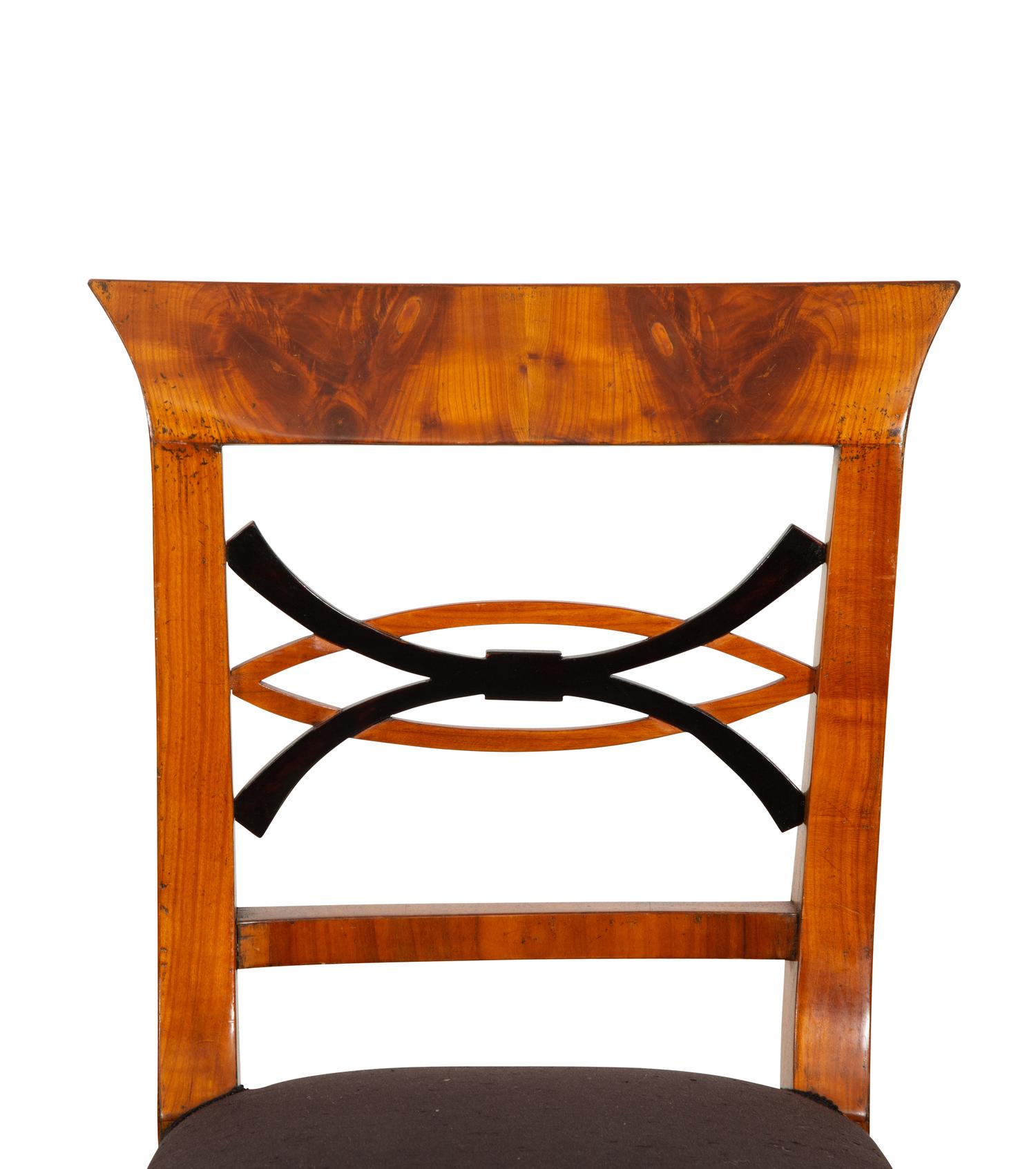 A Set of Four Biedermeier Part Ebonized Fruitwood Dining Chairs