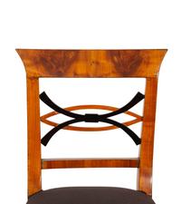 A Set of Four Biedermeier Part Ebonized Fruitwood Dining Chairs