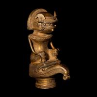 A Tairona Tumbaga Finial with a Shaman atop a Bird
